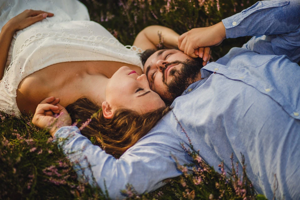 a man and woman lying on the ground