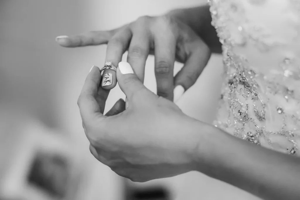 a person putting a ring on a finger
